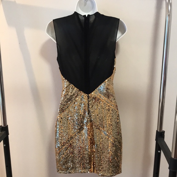 Bebe sequin dress. Low front plunge with a mesh back. - Picture 5 of 10